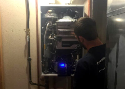 plumber servicing tankless water heater